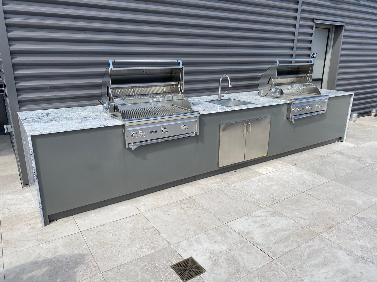 Stainless steel outdoor kitchen frame with built-in grills